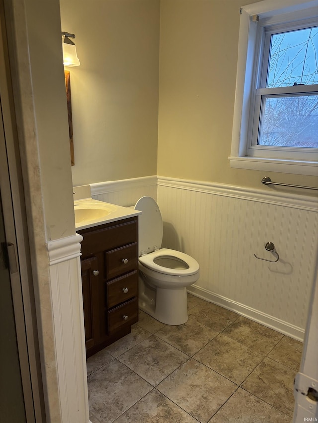 bathroom featuring toilet, vanity, and tile patterned floors