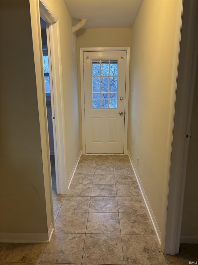 doorway featuring light tile patterned floors