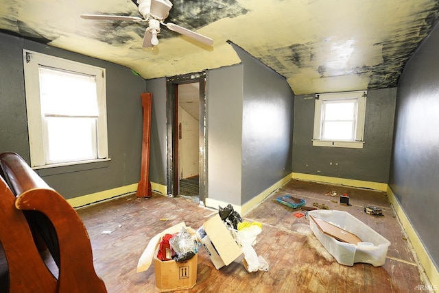 unfurnished room featuring ceiling fan and lofted ceiling