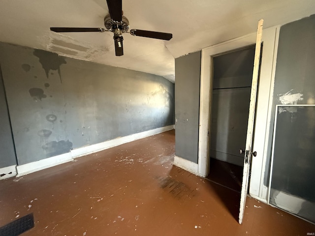 unfurnished bedroom featuring ceiling fan and lofted ceiling