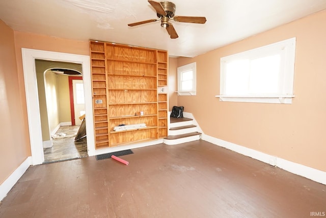 interior space featuring ceiling fan and dark hardwood / wood-style floors