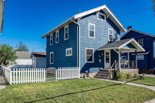 view of front of house with a front yard and covered porch