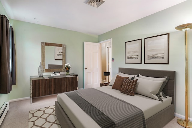 bedroom featuring light colored carpet and a baseboard heating unit