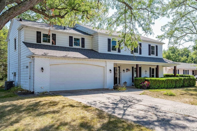 11510 Trails N Dr, Fort Wayne, IN 46845 - view of front of house featuring brick siding, covered porch, concrete driveway, central AC unit, and a shingled roof