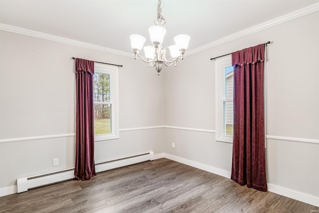 unfurnished room featuring wood-type flooring, ornamental molding, a baseboard radiator, and an inviting chandelier