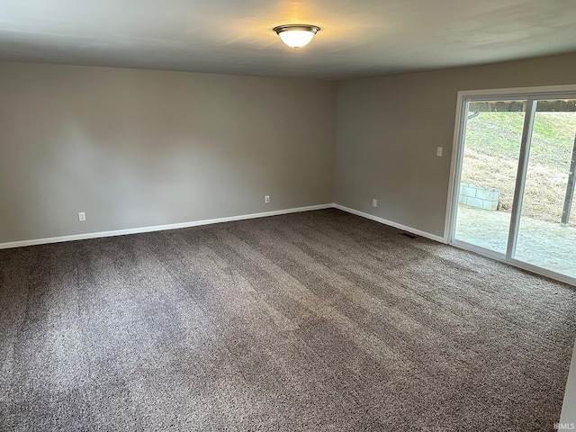 unfurnished room featuring carpet