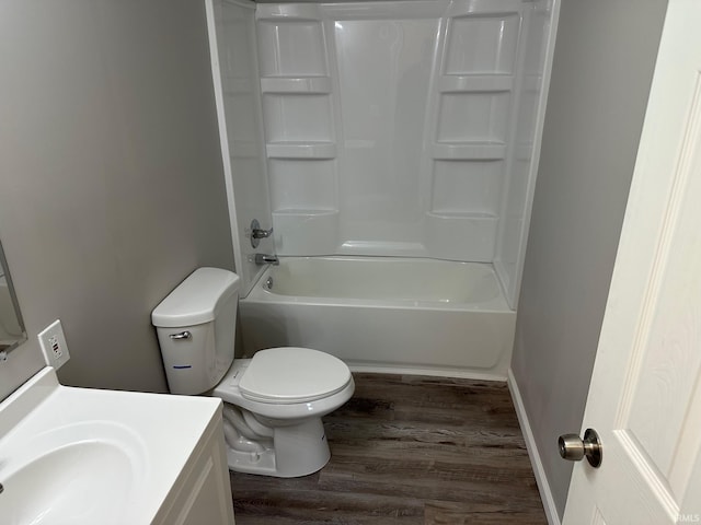 full bathroom featuring vanity, wood-type flooring,  shower combination, and toilet