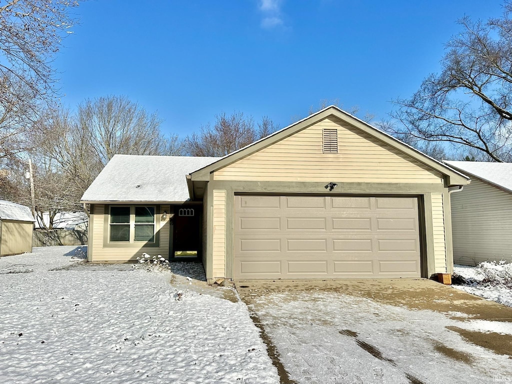 ranch-style home with a garage