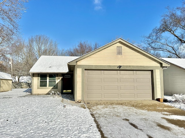 ranch-style home with a garage