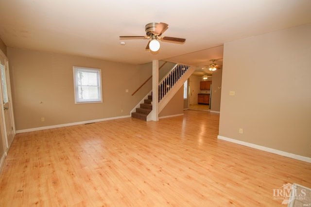 spare room with ceiling fan and light hardwood / wood-style flooring