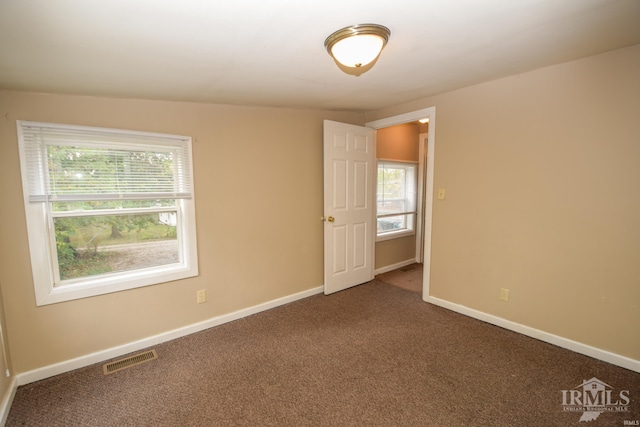 unfurnished room featuring carpet flooring