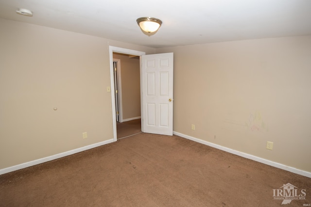 empty room with carpet flooring