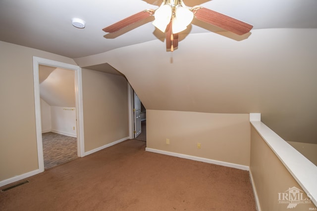 bonus room with ceiling fan, light colored carpet, and lofted ceiling