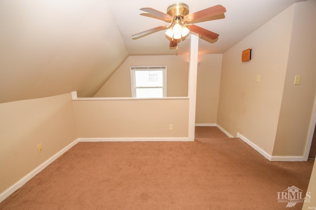 additional living space featuring light carpet, ceiling fan, and lofted ceiling