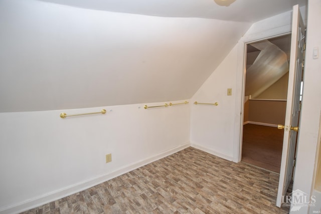 interior space with wood-type flooring and lofted ceiling