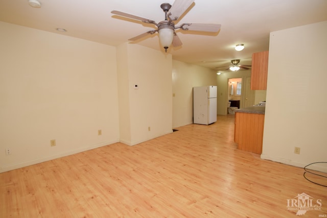 unfurnished living room with light hardwood / wood-style flooring