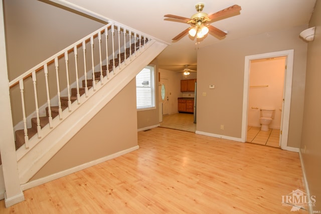 unfurnished living room with ceiling fan and hardwood / wood-style floors