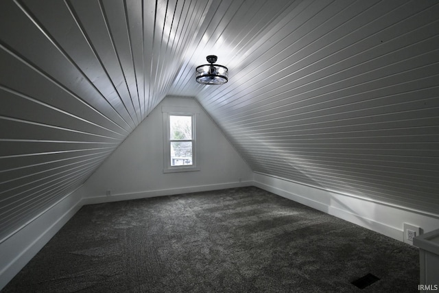 bonus room with carpet and lofted ceiling