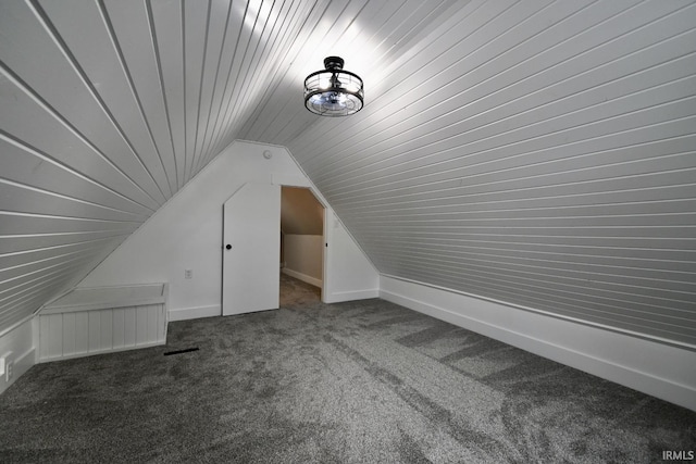 bonus room featuring carpet floors and lofted ceiling