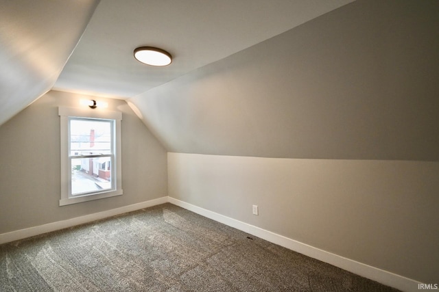 bonus room featuring carpet floors and lofted ceiling