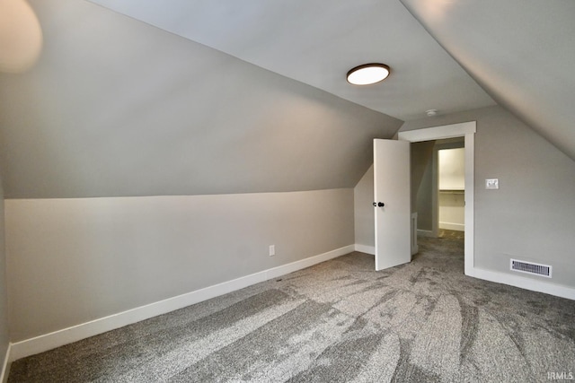 bonus room featuring carpet flooring and lofted ceiling