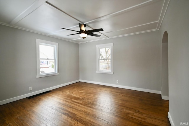 spare room with dark hardwood / wood-style floors, ceiling fan, and ornamental molding