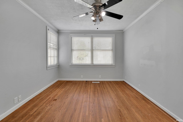 unfurnished room featuring ceiling fan, crown molding, a textured ceiling, and hardwood / wood-style flooring