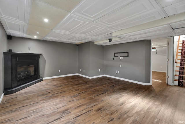 unfurnished living room featuring dark hardwood / wood-style flooring