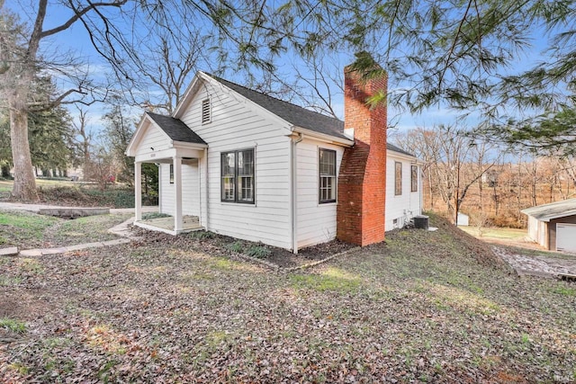 view of side of property featuring central AC