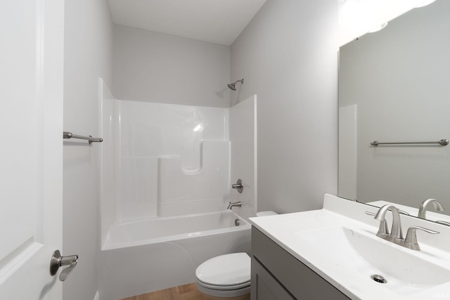 full bathroom with vanity, tub / shower combination, and toilet