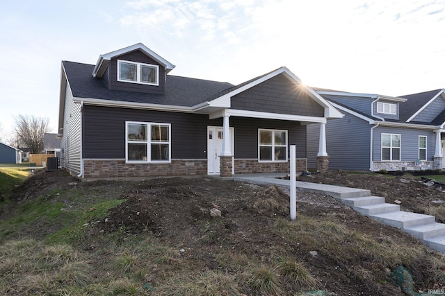 craftsman-style home featuring central air condition unit