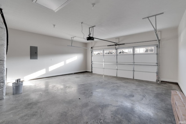 garage featuring electric panel and a garage door opener