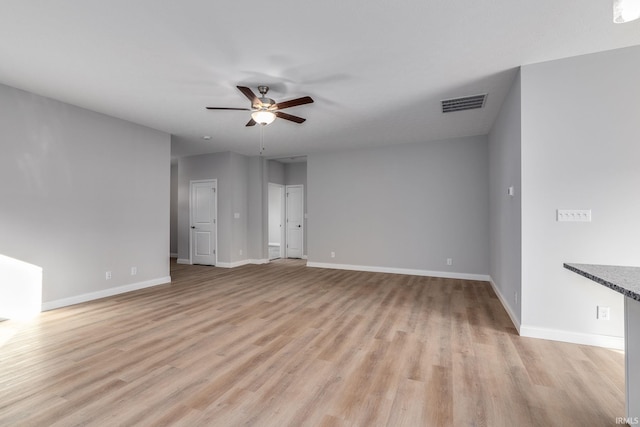 spare room featuring ceiling fan and light wood-type flooring