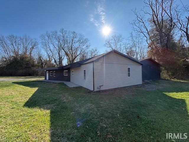 view of property exterior featuring a yard