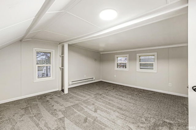 bonus room featuring plenty of natural light, carpet, and a baseboard heating unit