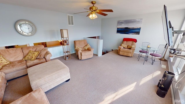 living room featuring carpet flooring and ceiling fan