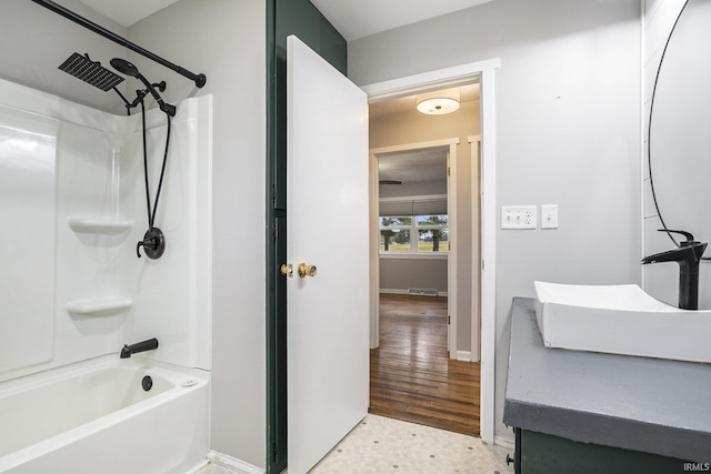 bathroom with sink and tub / shower combination