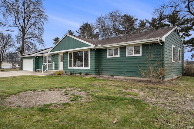 ranch-style home with solar panels, a garage, and a front lawn