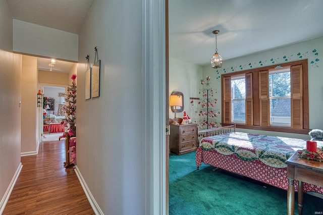 bedroom with dark wood-type flooring