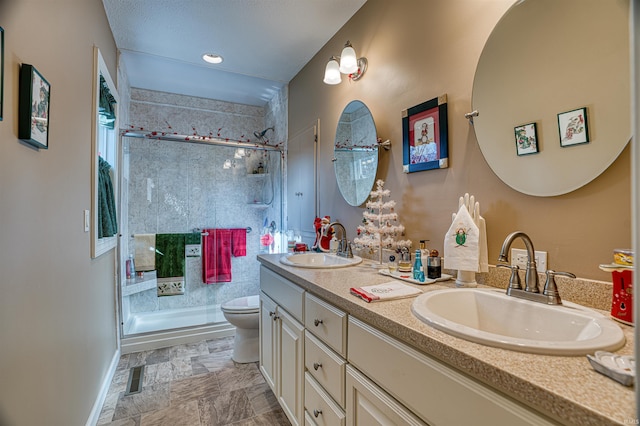 bathroom featuring vanity, toilet, and walk in shower