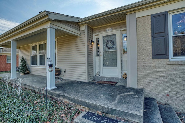 doorway to property featuring covered porch