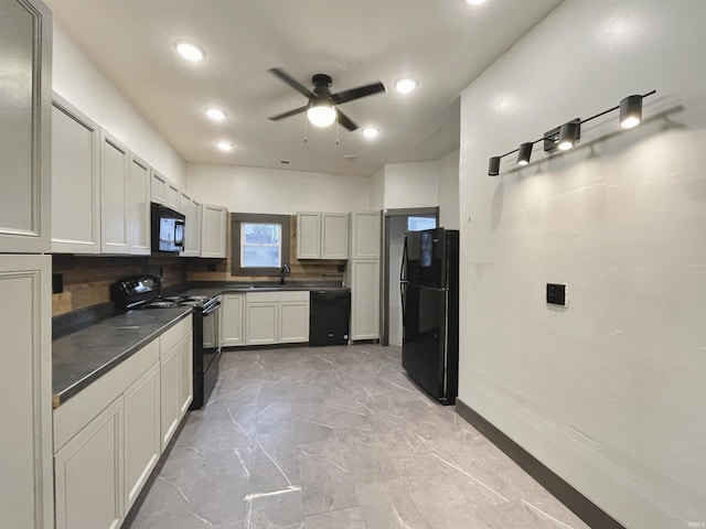 kitchen featuring decorative backsplash, ceiling fan, sink, black appliances, and white cabinets