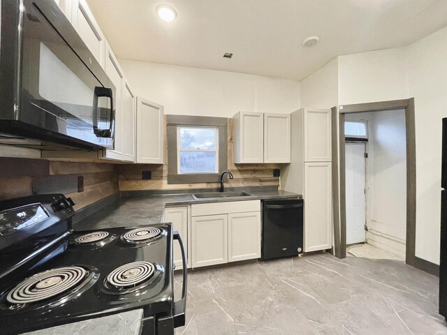 kitchen featuring white cabinets, decorative backsplash, sink, and black appliances