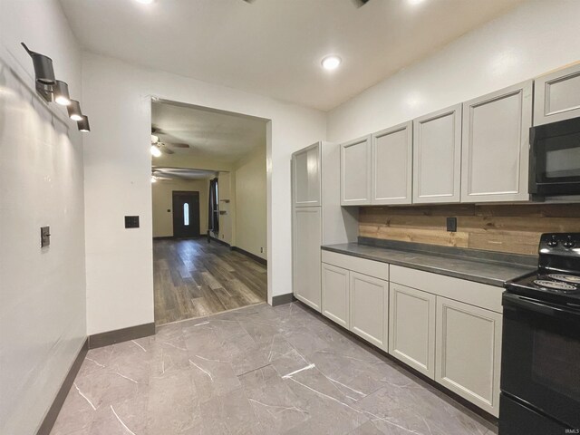 kitchen featuring tasteful backsplash, ceiling fan, and black appliances