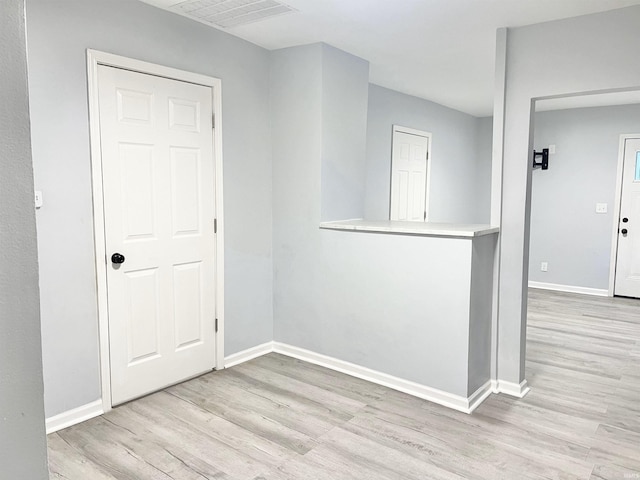 spare room featuring light wood-type flooring