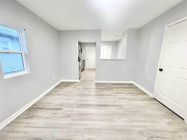 unfurnished room featuring light wood-type flooring