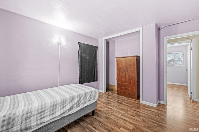 bedroom featuring hardwood / wood-style floors