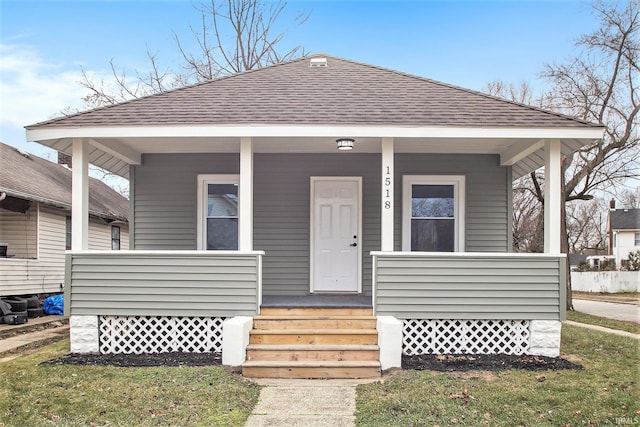 bungalow-style house featuring a front yard and a porch