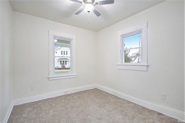 unfurnished room with ceiling fan and carpet floors