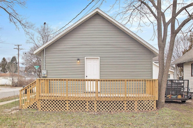 view of property exterior featuring a wooden deck